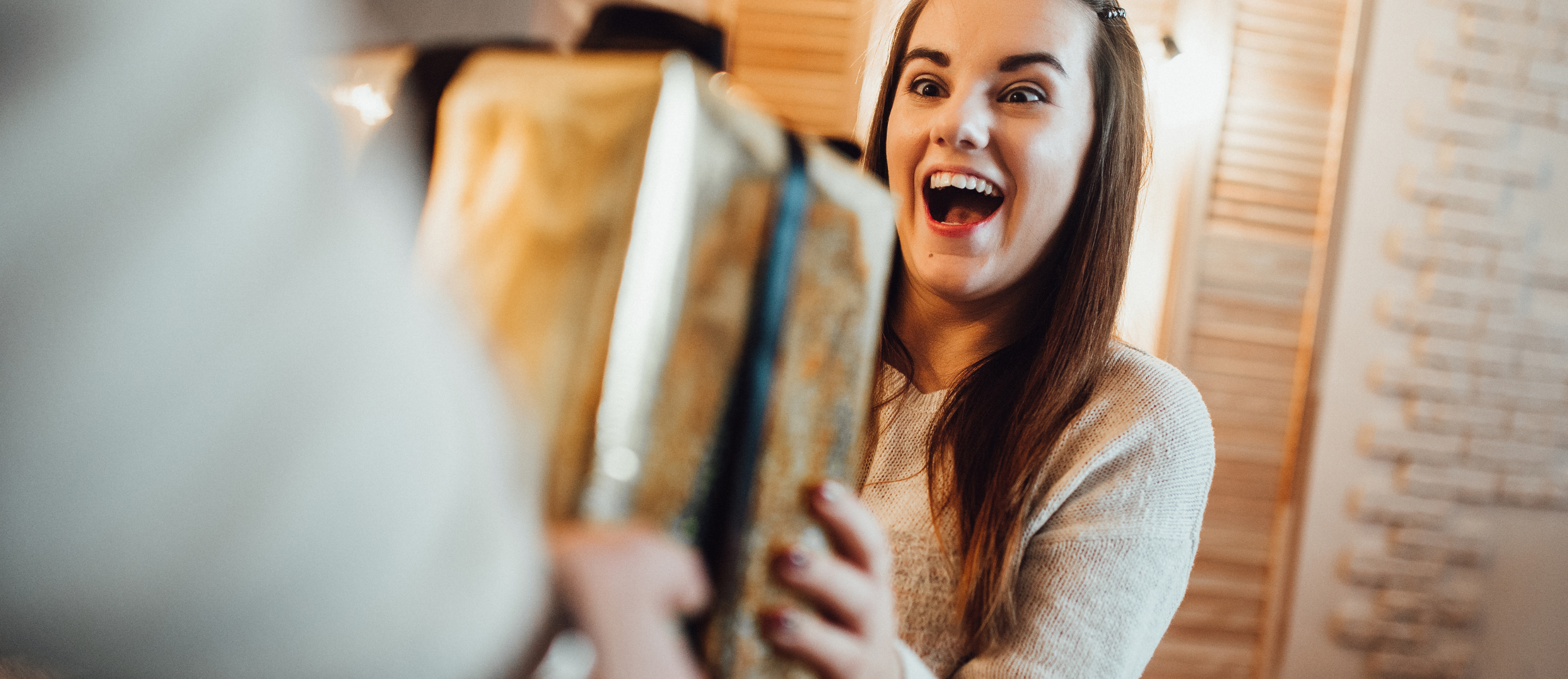 A girl receiving a Christmas present.